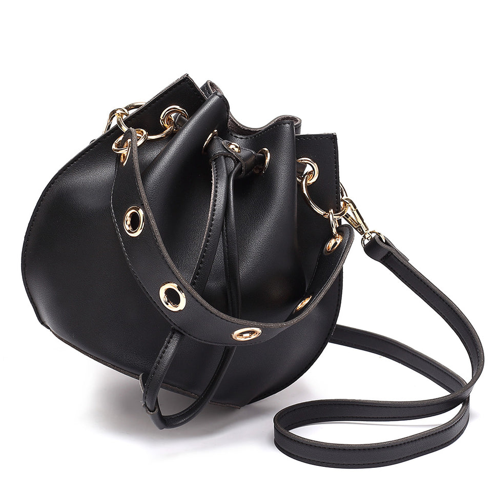 Eyelet drawstring faux leather bucket bag in Black