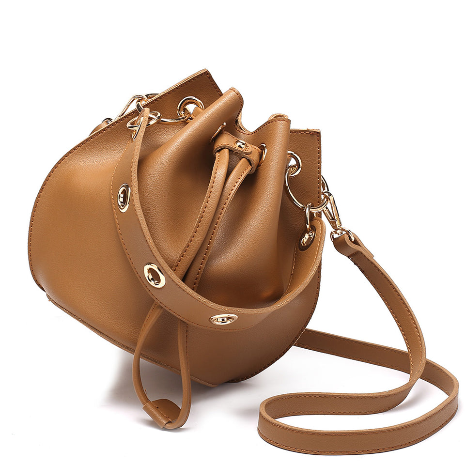 Eyelet drawstring faux leather bucket bag in Brown